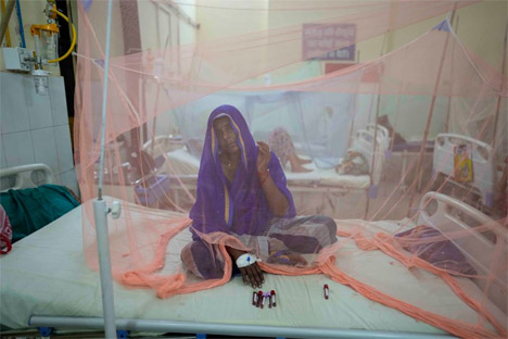 A dengue patient rests under a mosquito net at the dengue ward of the government Tej Bahadur Sapru hospital in Prayagraj, in the northern Indian state of Uttar Pradesh, Thursday, Oct. 13,2022 . Officials say infections following monsoon rains have led to a fever outbreak in this northern state. (AP Photo/Rajesh Kumar Singh)  AP